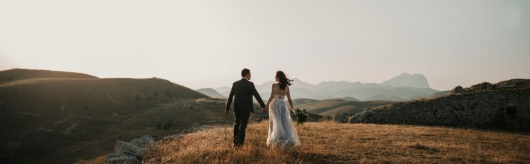 Preparing for a Successful Blend, a bride and groom stand overlooking mountains | FamilyLife®